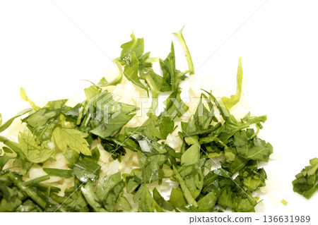 Close up of chopped fresh green herbs basil coriander parsley Close up of chopped fresh green herbs basil coriander parsley 136631989