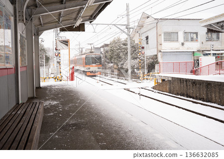 Tram running in the snow 136632085