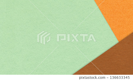 Mint textured paper background with orange brown triangular corners and copy space. Template for presentation, banner 136633345