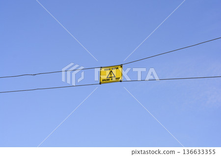High Voltage Warning Sign on Power Lines High Voltage Warning Sign on Power Lines 136633355