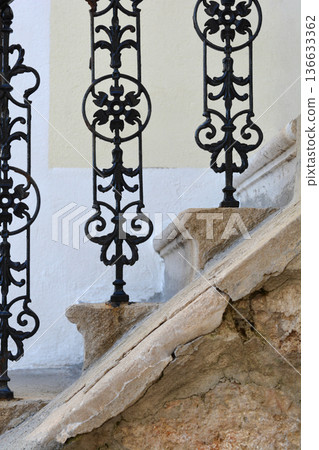Vintage Wrought Iron Railing on Old Stone Stairs Vintage Wrought Iron Railing on Old Stone Stairs 136633362