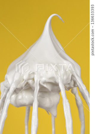 Meringue peak on a metal whisk 136633393