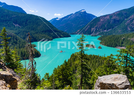 Landscape of mountain peak and Diablo lake. Nature landscape. Diablo Lake in North Cascades National Park. Scenic nature view over Diablo lake. Travel destination. Diablo lake with mountain landscape 136633553