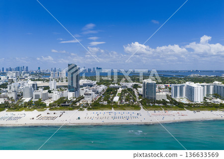 Aerial view of Miami beach coastline. Skyline and skyscrapers at Miami Beach. Summer Miamis vibes. Panoramic cityscape of Miami Beach. Famous landmarks of Miami. Aerial view of Miami beach coastline. Skyline and skyscrapers at Miami Beach. Summer Miamis vibes. Panoramic cityscape of Miami Beach. Famous landmarks of Miami. 136633569