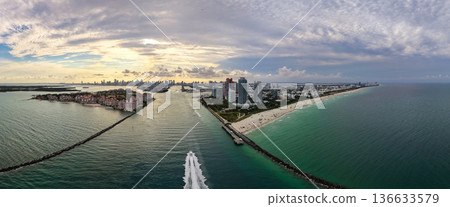 Panorama of Miami Beach skyline. Drone shot of Miami Beach cityscape. Top view of South Miami Beach and the ocean. Miami Beach skyline with skyscrapers and coastline from above. 136633579