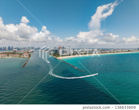 Aerial view of Miami Beach city by the coast. Miami Beach skyline. Scenic Miami Beach panorama famous coastline. Drone shot of Miami Beach above the shore. 136633609