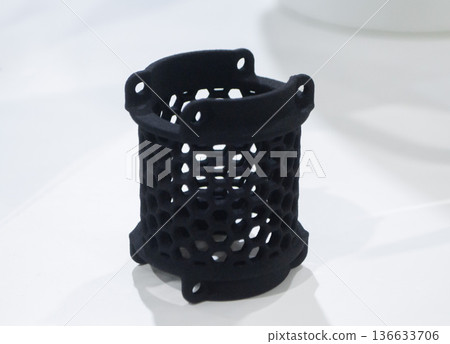 Object printed on 3D printer. Model printed on 3D printer from thermoplastic polyurethane. Prototype printed on 3D printer from powder with thermoplastic polyurethane. TPU technology. Printing concept Object printed on 3D printer. Model printed on 3D printer from thermoplastic polyurethane. Prototype printed on 3D printer from powder with thermoplastic polyurethane. TPU technology. Printing concept 136633706