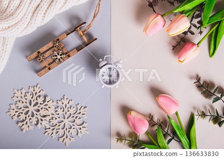 The concept of the spring equinox, the time between snow and flowers top view 136633830