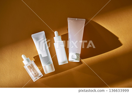 Skincare cosmetic products minimalist mockup on amber background 136633999