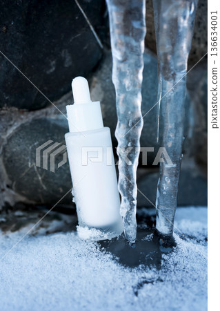 Skincare serum dropper bottle in frozen winter environment Skincare serum dropper bottle in frozen winter environment 136634001