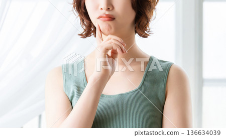 A woman thinking/beauty image 136634039