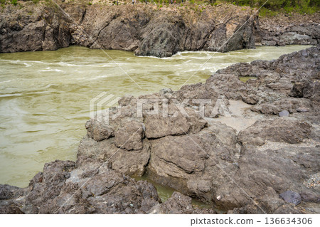 Narrowest and deepest section of Katun river with lava banks in Altai Russia. View from rocky gorge. 136634306