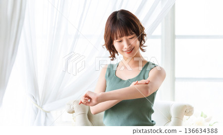 Woman checking her skin, beauty image Woman checking her skin, beauty image 136634388