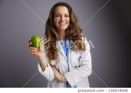 Healthcare Professional Holding Green Apple for Nutrition 136634606