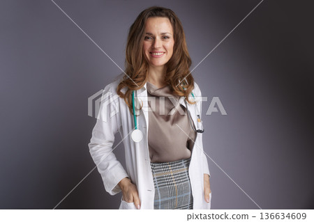 Portrait of Approachable Female Physician in White Coat Portrait of Approachable Female Physician in White Coat 136634609
