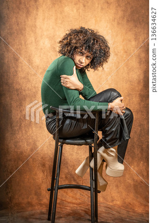 Woman with afro hair fashion studio style Woman with afro hair fashion studio style 136634627