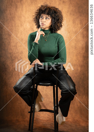 Thoughtful woman studio 136634636