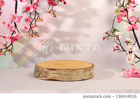 Empty birch podium for displaying cosmetics, set against elegant, sunny, and colorful banner with pink sakura blossoms. The perfect template for your creative work, summer party concept, Empty birch podium for displaying cosmetics, set against elegant, sunny, and colorful banner with pink sakura blossoms. The perfect template for your creative work, summer party concept, 136634816