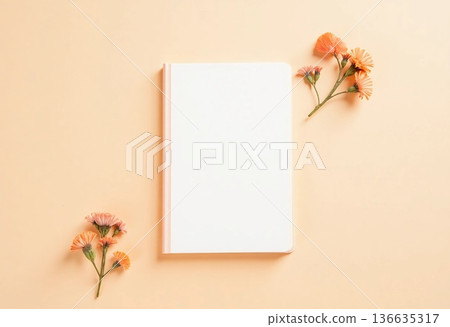 In a serene setting, a blank notepad lies open with delicate flowers surrounding it, creating a peaceful atmosphere perfect for writing or sketching thoughts and ideas Generative AI 136635317