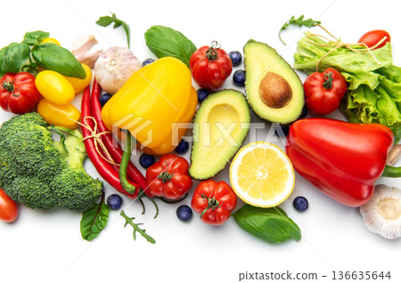 Assortment of fresh organic vegetables and fruits on white 136635644