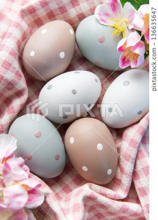 Pastel polka dot easter eggs in checkered basket Pastel polka dot easter eggs in checkered basket 136635647