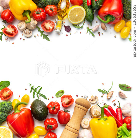 Fresh vegetables forming a food border on white 136635655
