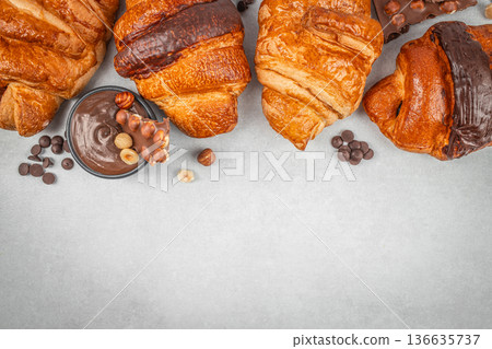 Assorted chocolate croissants with hazelnut cream banner 136635737