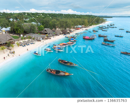 Aerial view of tourist boats and traditional fishing boats in sea Aerial view of tourist boats and traditional fishing boats in sea 136635763