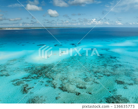 Aerial view of tropical sandbank with boats in turquoise water Aerial view of tropical sandbank with boats in turquoise water 136635773