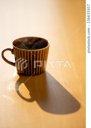 Coffee steam shining through sunlight_Vertical Coffee steam shining through sunlight_Vertical 136635957