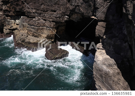Waves crashing into a sea cave at Boca do Inferno, Portugal 136635981