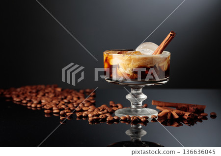 Cocktail of cream and coffee on a black background. Cocktail of cream and coffee on a black background. 136636045