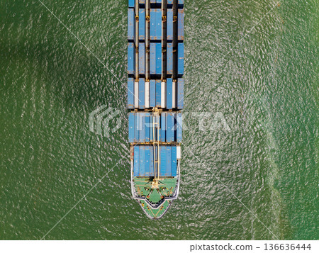 Aerial cargo ship with container. Cargo business. Container ship. Shipping logistics. Commercial shipping. Cargo ship in sea, aerial view. Freight container loaded on cargo vessel. Ship route 136636444