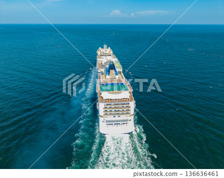 Cruise ship vacation. Aerial view of cruise ship in vacation summer. Cruise ship vacation and travel at sea. Aerial drone view of luxury liner. Ship heading to seascape horizon Cruise ship vacation. Aerial view of cruise ship in vacation summer. Cruise ship vacation and travel at sea. Aerial drone view of luxury liner. Ship heading to seascape horizon 136636461