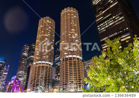 Night cityscape of Chicago skyscraper building. Chicago architecture of skyscraper. City night illuminated building. Skyscraper cityscape. Night city of Chicago. Business city Night cityscape of Chicago skyscraper building. Chicago architecture of skyscraper. City night illuminated building. Skyscraper cityscape. Night city of Chicago. Business city 136636489