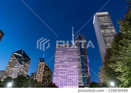 Chicago architecture of skyscraper. City night illuminated building. Skyscraper cityscape. Night city of Chicago. Business city. Night cityscape of Chicago skyscraper building. City lights glow 136636496