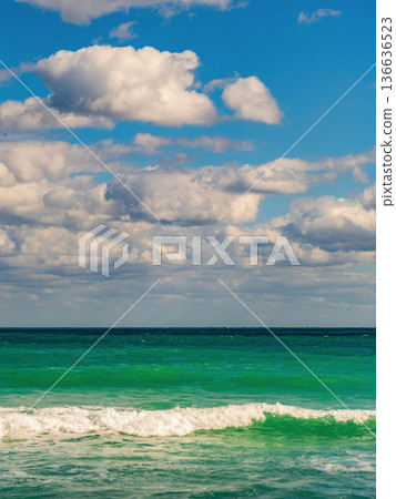 Seascape horizon paradise. Sea sunrise on ocean beach. Sunset seascape at summer vacation. Horizon with sea cloudy sky. Calm horizon at sea. Romantic summer vacation seascape. Beach at sunset 136636523