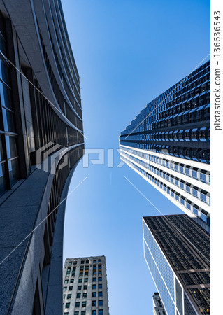 Skyscraper building architecture. Business skyscraper. Modern glass building. Skyscraper in city downtown. City downtown with skyscraper. Office building in business district. Iconic city Skyscraper building architecture. Business skyscraper. Modern glass building. Skyscraper in city downtown. City downtown with skyscraper. Office building in business district. Iconic city 136636543