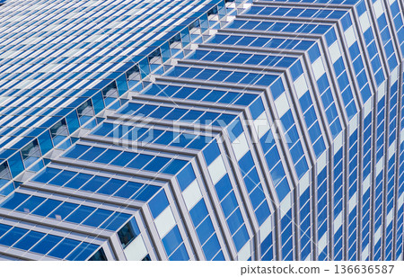 Background architecture. Modern glass background. Glass exterior background. Architecture. Building exterior architecture. Building background. Glass reflecting building. Architectural detail Background architecture. Modern glass background. Glass exterior background. Architecture. Building exterior architecture. Building background. Glass reflecting building. Architectural detail 136636587