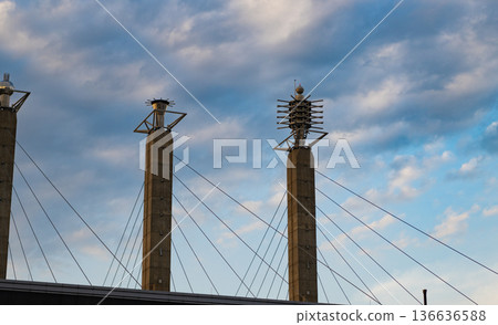 Bartle Hall Pylons. Building design. Modern architecture. Modern building architecture against blue sky. Architectural pylon detail. Exterior of building with pylon Bartle Hall Pylons. Building design. Modern architecture. Modern building architecture against blue sky. Architectural pylon detail. Exterior of building with pylon 136636588