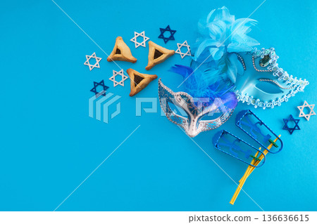 Purim holiday attributes on blue background with copy space 136636615