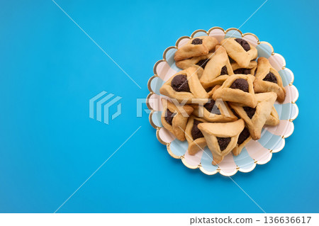 Hamantaschen cookies for purim celebration on blue background Hamantaschen cookies for purim celebration on blue background 136636617