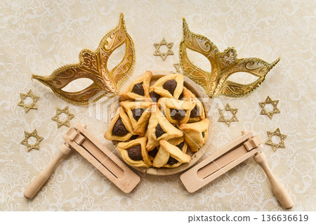Purim celebration with hamantaschen, masks, graggers, and star of david Purim celebration with hamantaschen, masks, graggers, and star of david 136636619