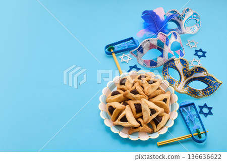 Purim jewish holiday celebration with hamantaschen and masks Purim jewish holiday celebration with hamantaschen and masks 136636622