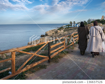 Hergla, Tunisia - Dec 25, 2025: Coastal Peace: The Winter Promenade of Sidi Bou Ali Cove near Hergla Hergla, Tunisia - Dec 25, 2025: Coastal Peace: The Winter Promenade of Sidi Bou Ali Cove near Hergla 136637526