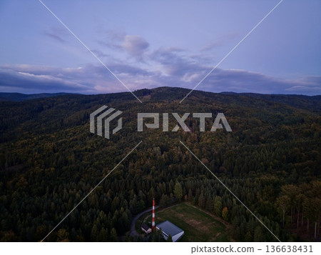 Quiet Evening Landscape, Tranquil Wooded Hilltop At Dusk Featuring Lone Cottage And Meandering Road Scene 136638431