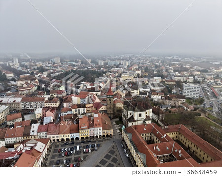 Cobblestone Plaza Under Cloudy Skies, Ancient Town Square With Terracotta Roofs And Narrow Streets Cobblestone Plaza Under Cloudy Skies, Ancient Town Square With Terracotta Roofs And Narrow Streets 136638459