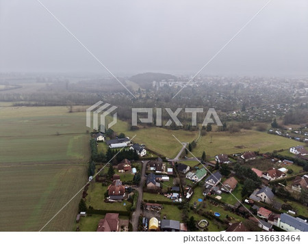 Peaceful Countryside With Scattered Homesteads, Calm Agricultural Scene With Fields And Distant Farmhouses 136638464