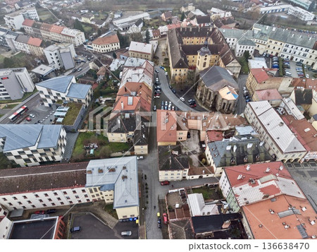 Overhead Perspective Capturing Narrow Lane Flanked By Historic Terracottaroofed Structures And Shaded Walkways 136638470