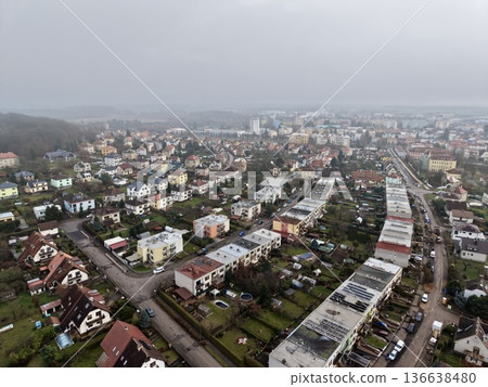 Birdseye View Highlighting Winding Residential Structures Alongside Vibrant Gardens And Streetscapes Birdseye View Highlighting Winding Residential Structures Alongside Vibrant Gardens And Streetscapes 136638480
